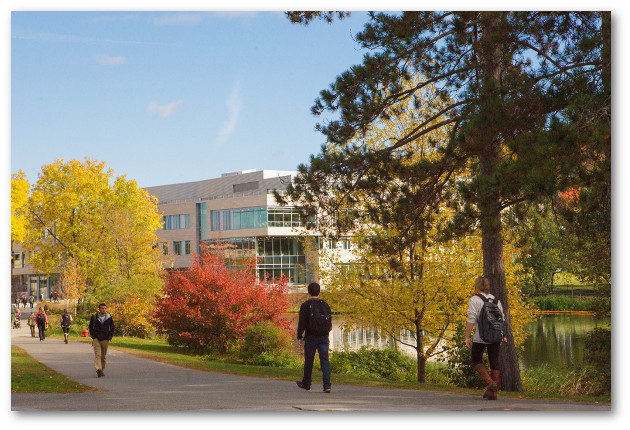 Students walking by pond heading towards ILC