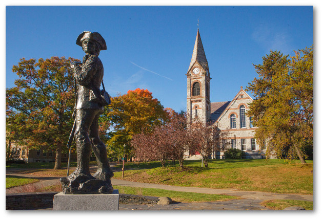 Minuteman statue in the foreground in front of Old Chapel