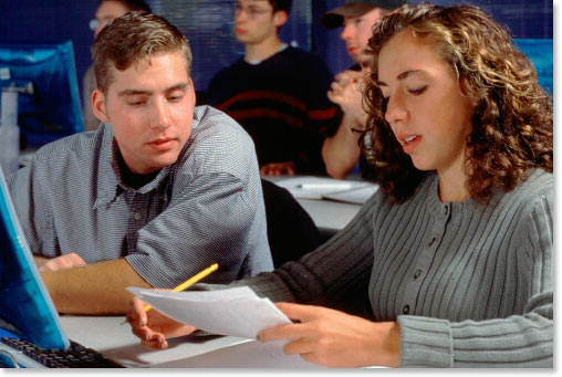 two students studying at a computer