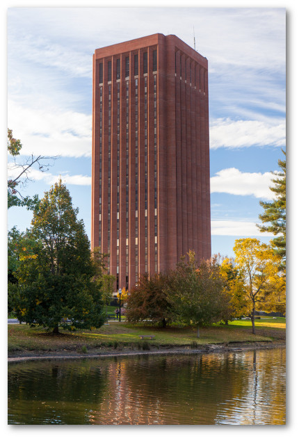 Dubois Library with trees changing colors in foreground  viewed from across pond